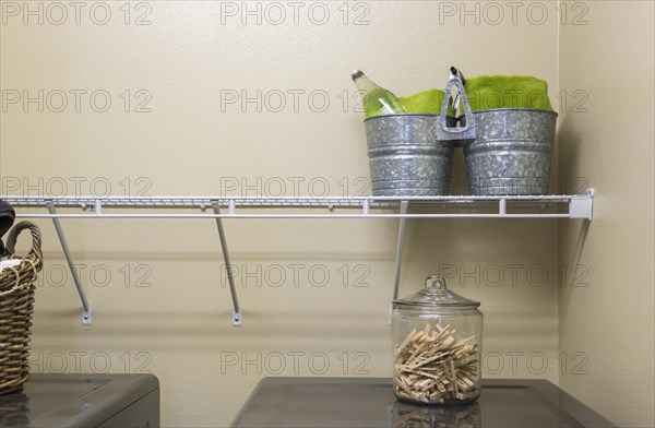 Abstract of laundry room with buckets and jar of clothespins