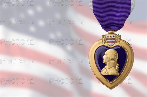 Purple heart miltary merit medal against ghosted american flag