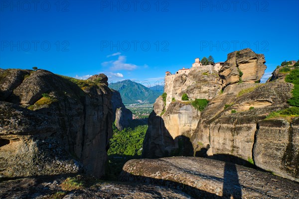 Monastery of Varlaam monastery in famous greek tourist destination Meteora in Greece on sunset with scenic scenery landscape