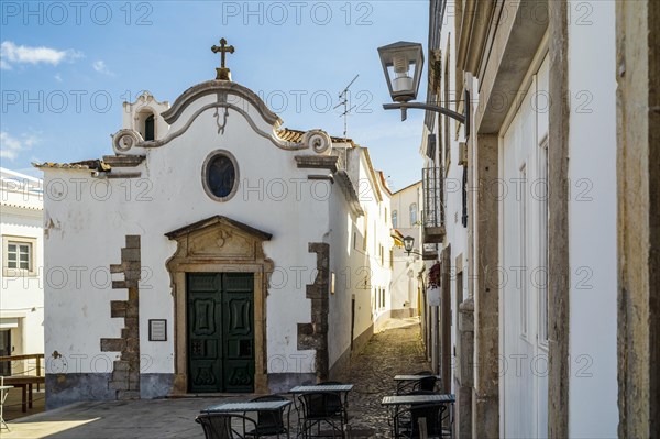 Charming chapel of Our Lady of Pity between narrow streets of Tavira