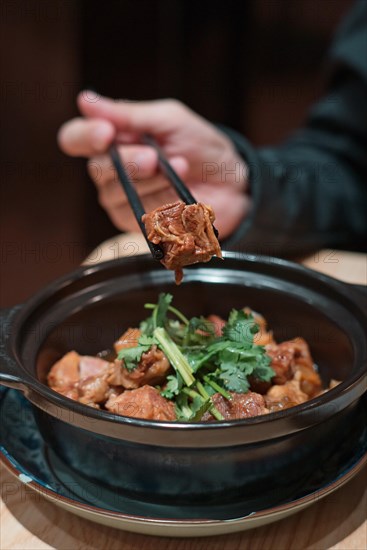 Chopsticks with beef in a Cantonese restaurant in Macau