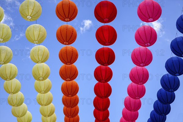 Colourful lanterns strung across the street