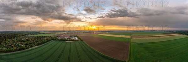 Fields in the sunset. Aerial panorama photo of an idyllic farming moment
