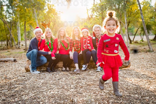 Christmas themed multiethnic family portrait outdoors