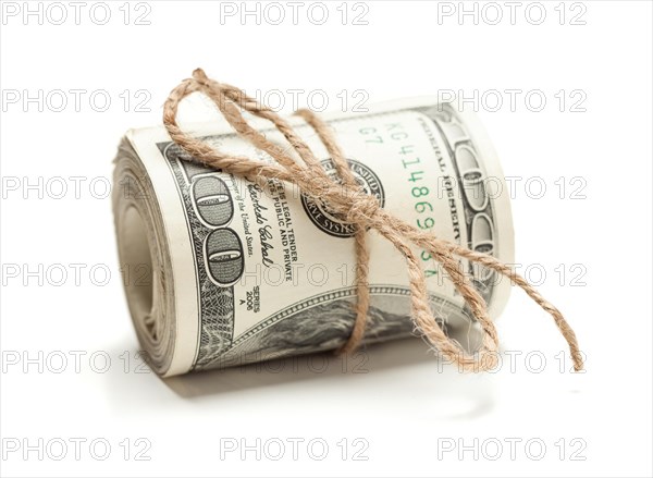 Roll of one hundred dollar bills tied in burlap string on white