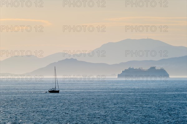 Cruise liner ship and yacht silhouette in Mediterranea sea