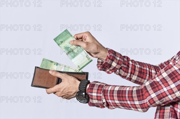 Man taking money out of his wallet