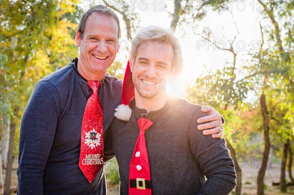 Handsome festive father and son portrait outdoors