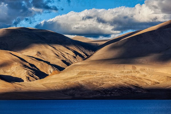 Himalayas and Himalayan mountain lake Tso Moriri on sunset. Korzok