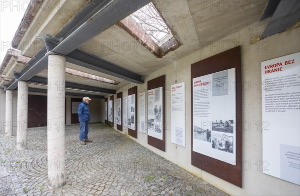 Hikers in front of the information boards of the Iron Curtain Memorial at the Guglwald border crossing