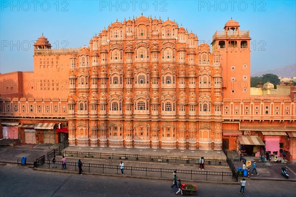 Famous landmak pink Hawa Mahal Palace of winds with people