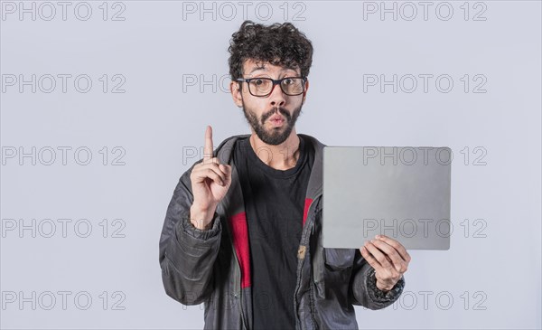 Young man holding poster