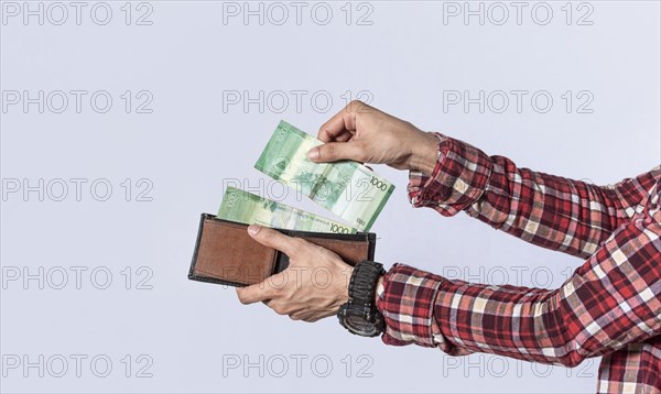 Man taking money out of his wallet