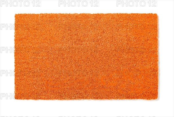 Blank orange welcome mat isolated on white background ready for your own text