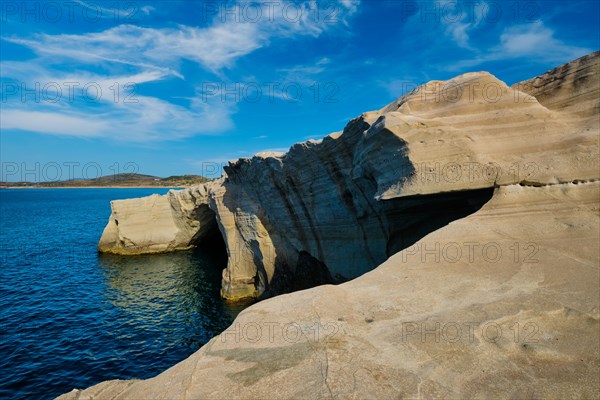 White rocks of famous tourist attraction of Milos island Sarakiniko beach and Aegean sea