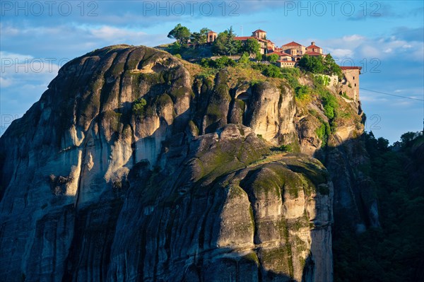 Great Meteoron Monastery perched on a cliff in famous greek tourist destination Meteora in Greece on sunrise