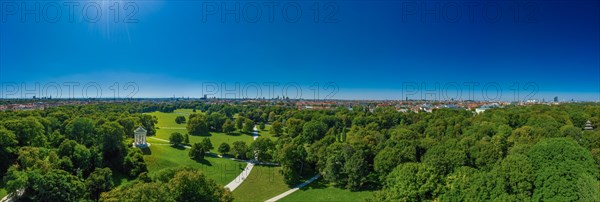 English Garden in Munich at springtime with green trees and the Monopterostempel as Aerial