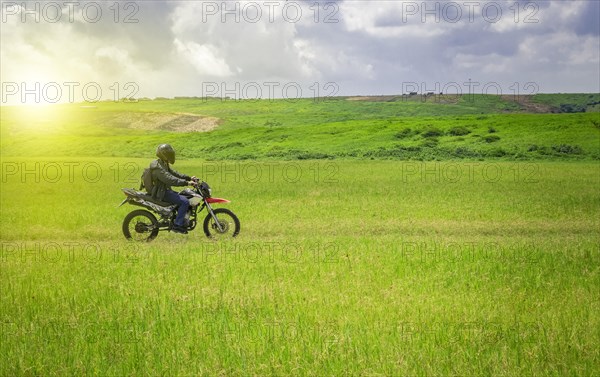 Biker man on a country road