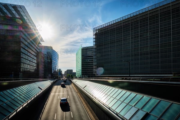 Street traffic in Brussels near European Commission building on sunset. Rue de la Loi