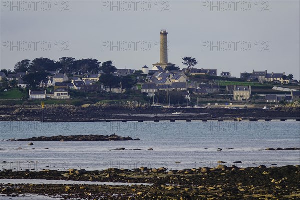 View at low tide from Roscoff to the island Ile de Batz with lighthouse