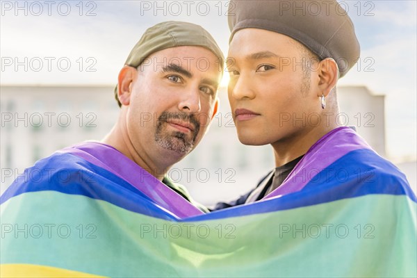 Couple of gay men in love embracing each other