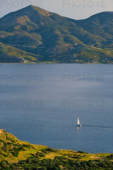 Yacht boat in Aegean sea near Milos island on sunset. Milos island
