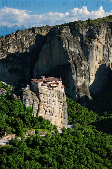 Monastery of Rousanou in famous greek tourist destination Meteora in Greece on sunset with scenic landscape