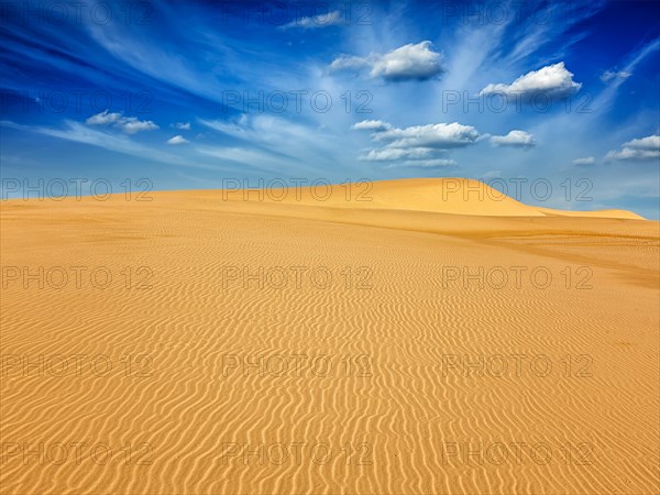 White sand dunes in desert on sunrise