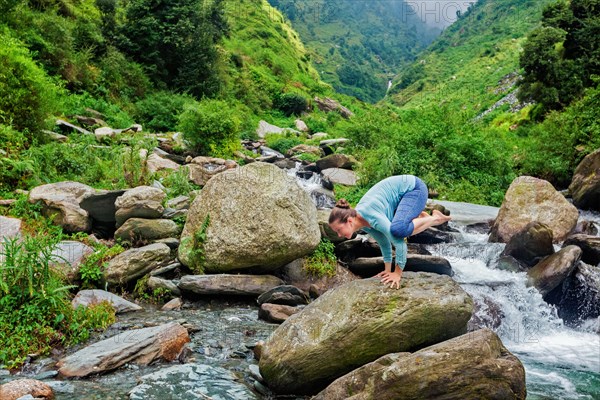 Woman doing Kakasana asana