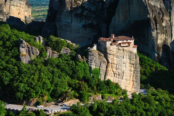 Monastery of Rousanou in famous greek tourist destination Meteora in Greece on sunset with scenic landscape