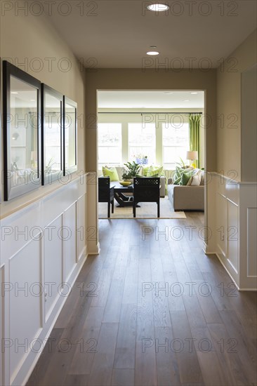 Beautiful home entry way with wood floors and wainscoting