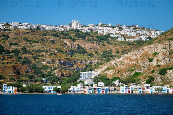 Klima and Plaka villages with whitewhashed traditional houses and orthodox church and windmills on Milos island