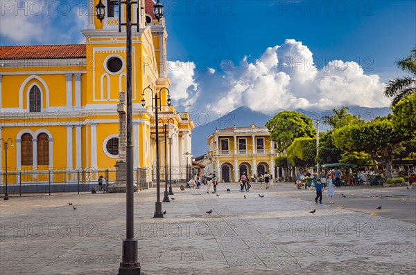 Beautiful plaza with people around in a sunset