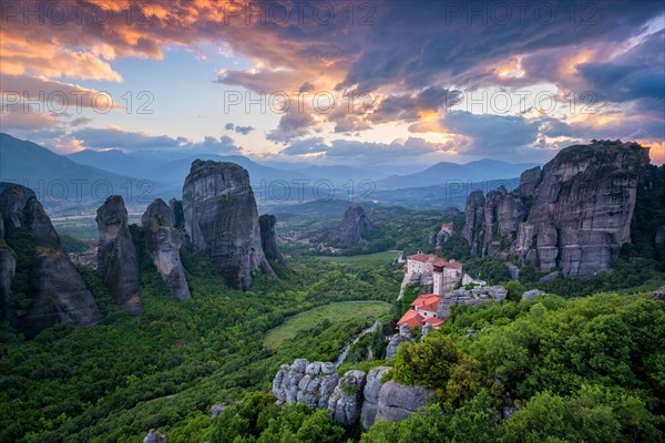 Sunset sky and monastery of Rousanou and Monastery of St. Nicholas Anapavsa in famous greek tourist destination Meteora in Greece with dramatic sky