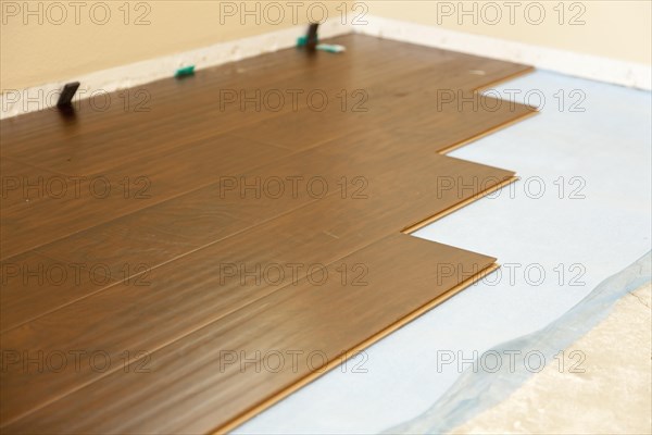 Newly installed brown laminate flooring abstract
