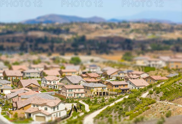 Aerial view of populated neigborhood of houses with tilt-shift blur