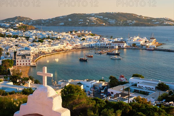 View of Mykonos town Greek tourist holiday vacation destination with famous windmills