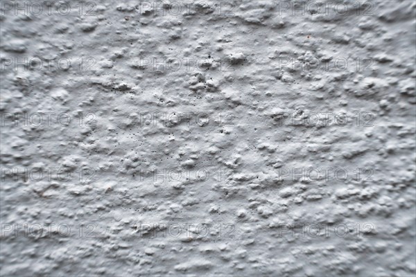 A white wall with bumps