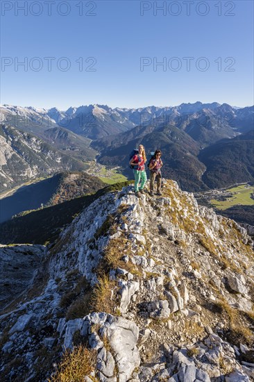 Two female hikers on a summit