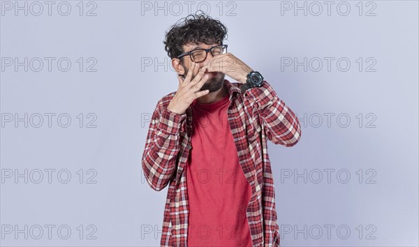 A man with covering his nose