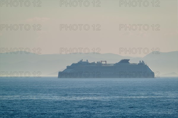 Cruise liner ship silhouette in Mediterranea sea. Aegean sea