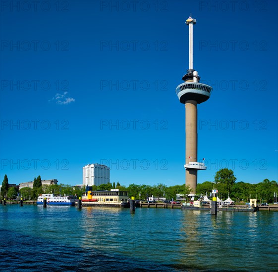 Rotterdam cityscape with Euromast observation tower and tourist boat on Nieuwe Maas river