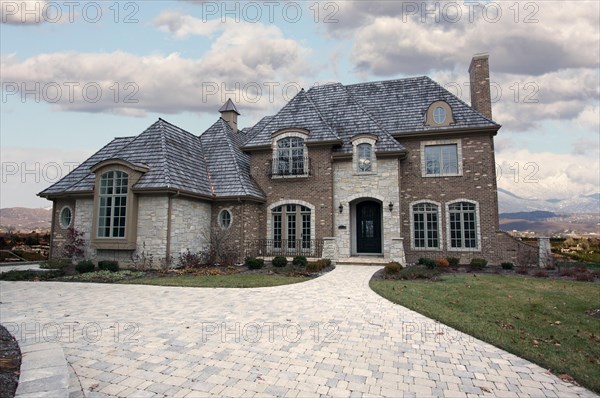 Majestic newly constructed home facade on a blustery day