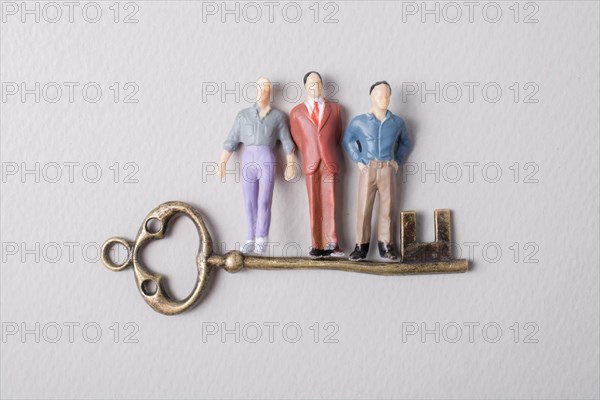 Tiny figurine of man miniature and retro key