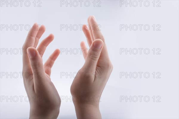 Hand holding gesture made on a white background