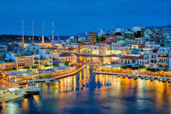 Beautiful Agios Nikolaos town on lake Voulismeni at night. Lasithi region of Crete island