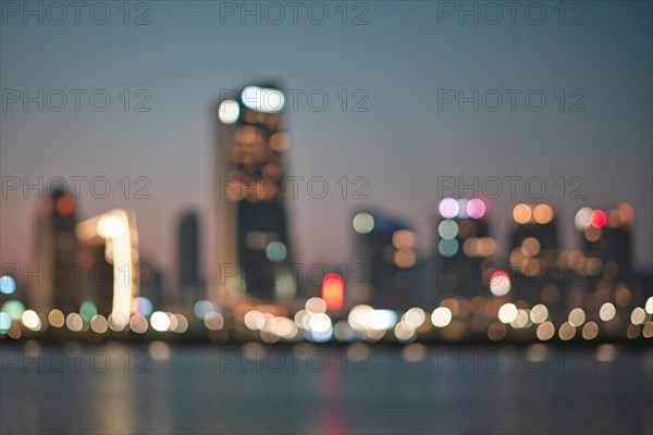 Bokeh lights of city buildings at night in Macau