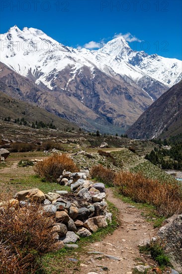 Old trade route in Himalaya surrounded with stones to Tibet from Chitkul village from Sangla Valley