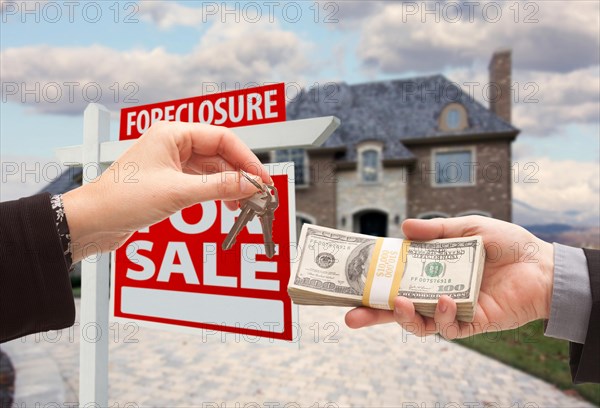 Handing over cash for house keys in front of house and foreclosure sign