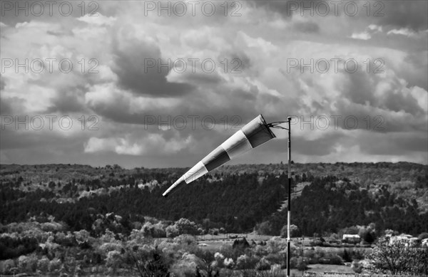 Windsock and cloudy sky